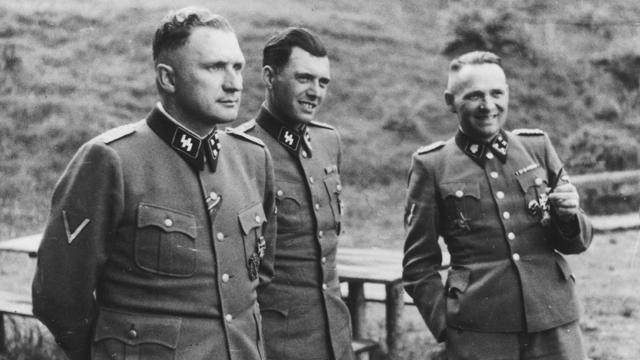 Dr. Josef Mengele (Center) also known as the “Angel of Death” was most notorious for the murder of tens of thousands of Jews and other “non-Aryan” people as the Chief Doctor of Auschwitz. Credit: The United States Holocaust Memorial Museum